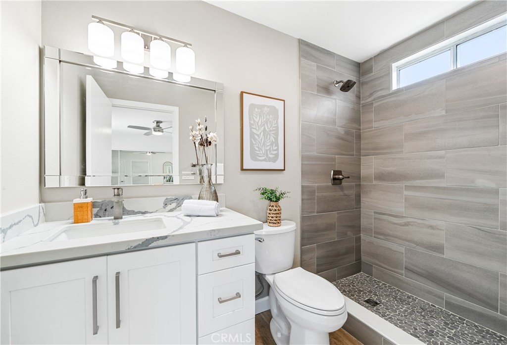 Custom wood vanity bathroom with brushed brass fixtures