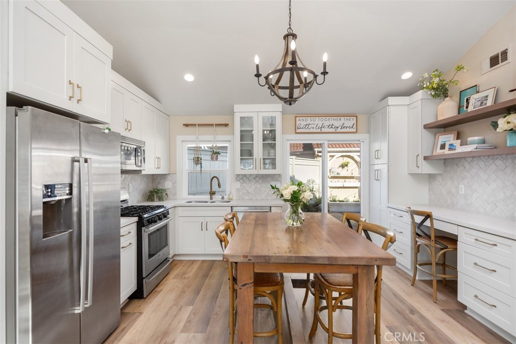 Warm neutral kitchen with custom cabinetry by Restore Design Co.